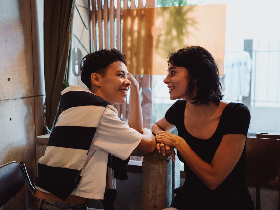 Two people sharing a warm, supportive conversation